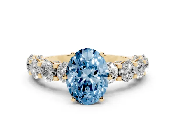Fancy Blue Oval Cut Diamond Side Stone Engagement Ring with Four-Prong Setting Yellow gold