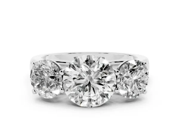 Round Cut Three-Stone Diamond Ring with Prong Setting on a Classic Band Platinum