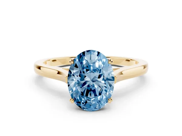 Fancy Blue Oval Cut Solitaire Heart Prong Engagement Ring with Tapered Band Yellow gold
