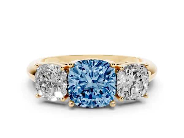 Fancy Blue Three-Stone Cushion Cut Cut Diamond Engagement Ring with Prong Setting on a White Gold Band Yellow gold