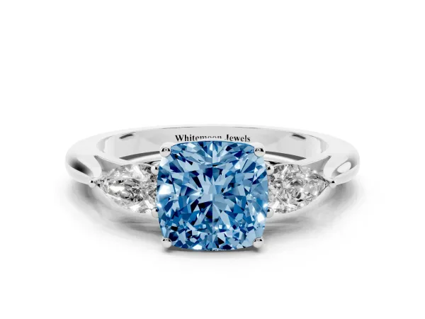 Fancy Blue Three-Stone Cushion Cut Diamond Ring with Pear Side Stones in Four-Prong Setting Platinum