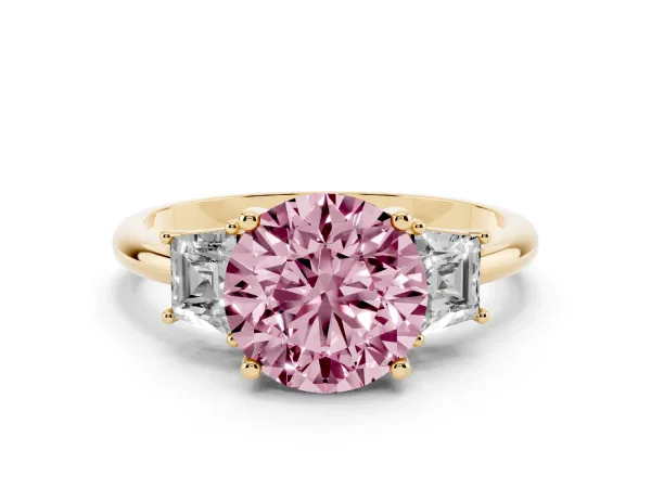 Fancy Pink Round Cut Diamond Three-Stone Ring with Trapezoid Side Stones and Prong Setting Yellow gold