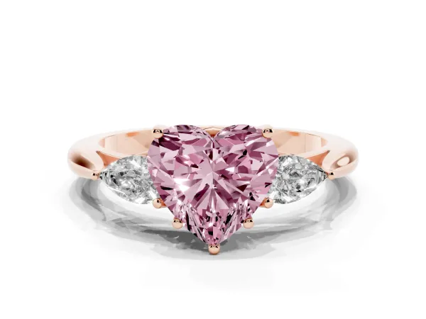 Fancy Pink Three-Stone Heart Cut Brilliant Diamond Solitaire Ring with Tapered Band and Four-Prong Setting Rose gold