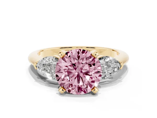 Fancy Pink Three-Stone Round Cut Diamond Ring with Pear Side Stones and Four-Prong Setting Yellow gold