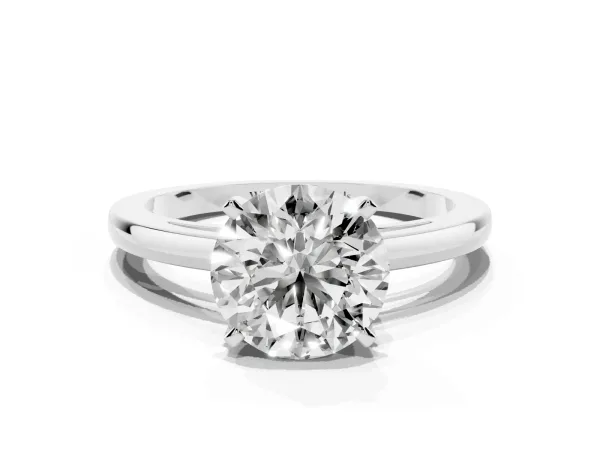 Round Cut Solitaire Diamond Engagement Ring with Four-Prong Setting on a Classic Band Platinum