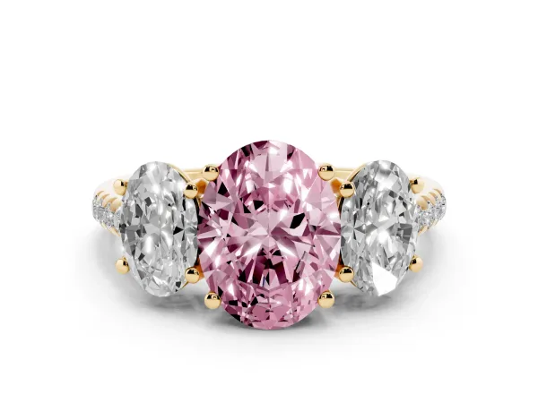 Fancy Pink Three-Stone Oval Cut Diamond Ring with Round Pavé Band and Prong Setting Yellow gold
