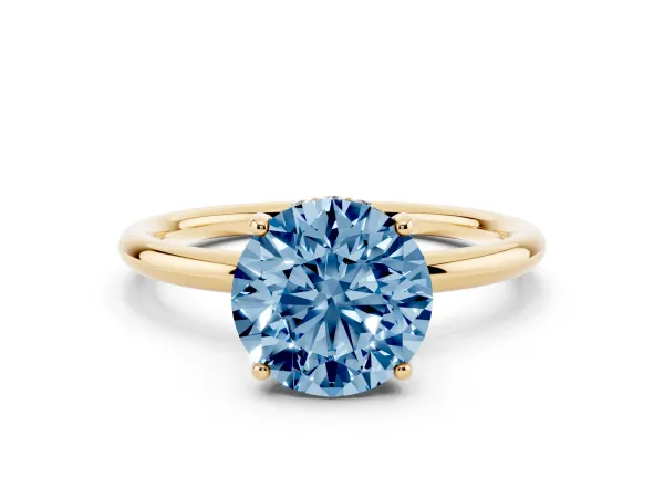 Fancy Blue Round Cut Solitaire Diamond Ring with a Classic Band and Four-Prong Setting Yellow gold