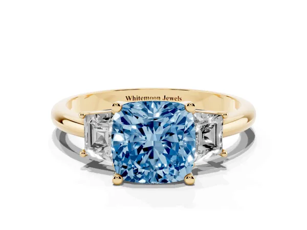 Fancy Blue Cushion Cut Diamond Three-Stone Ring with Trapezoid Side Stones and Prong Setting Yellow gold