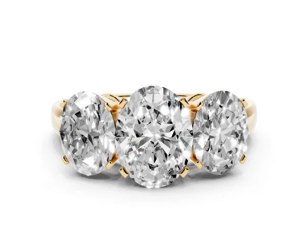 Three-Stone Oval Cut Cut Diamond Ring with Channel Set Band and Four-Prong Setting Yellow gold