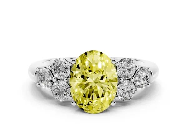 Fancy Yellow Oval Cut Cut Diamond Cluster Ring with Round Accent Stones and Prong Setting on a Classic Band Platinum