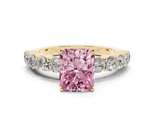 Fancy Pink Radiant Cut Diamond Solitaire Ring with Shared Prong Round Side Stones Yellow gold
