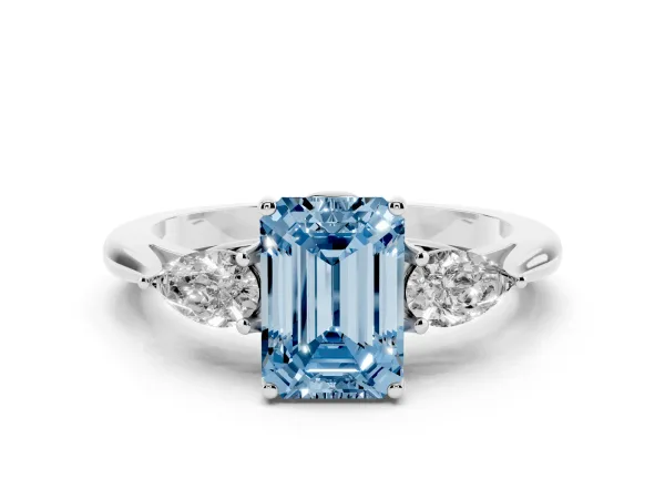 Fancy Blue Three-Stone Emerald Cut Diamond Ring with Pear Side Stones in Four-Prong Setting White gold