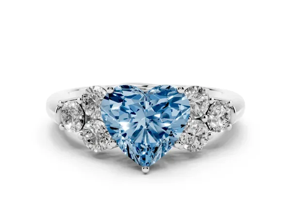Fancy Blue Heart Cut Cut Diamond Cluster Ring with Round Accent Stones and Prong Setting on a Classic Band Platinum