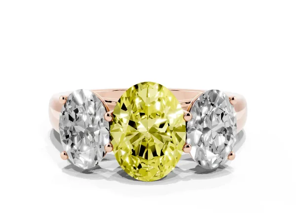 Fancy Yellow Oval Cut Three-Stone Diamond Ring with Prong Setting on a Classic Band Rose gold
