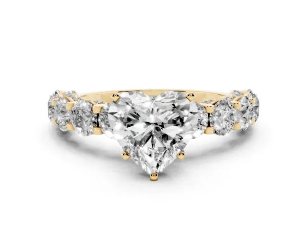 Heart Cut Diamond Side Stone Engagement Ring with Four-Prong Setting Yellow gold
