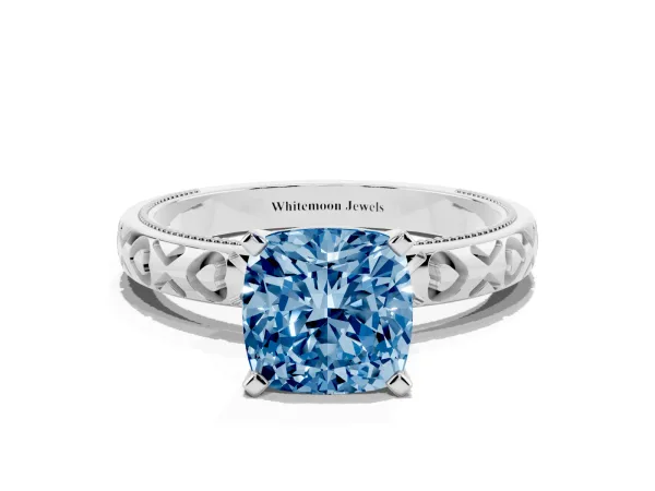 Fancy Blue Cushion Cut Solitaire Diamond Engagement Ring with XO Engraved Band and Four-Prong Setting Platinum