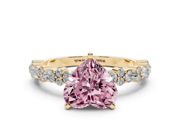 Fancy Pink Heart Cut Diamond Side Stone Solitaire Ring with Round and Four-Prong Setting Yellow gold
