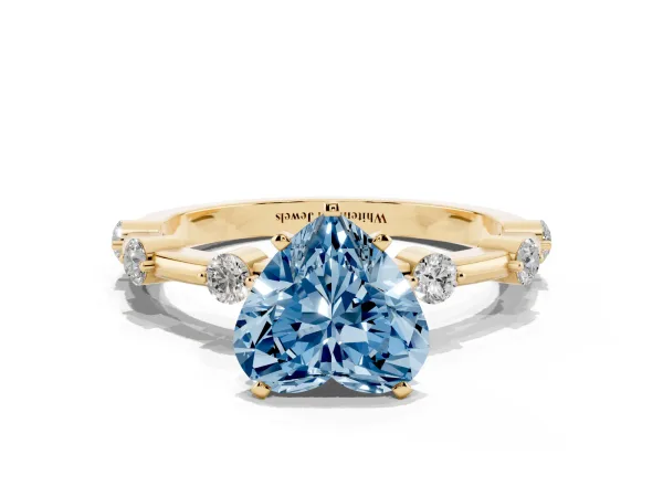 Fancy Blue Heart Cut Solitaire Diamond Ring with Bezel Set Side Stones and Prong Setting Yellow gold