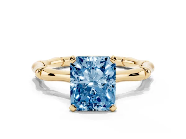 Fancy Blue Radiant Cut Solitaire Diamond Ring with Bamboo Band and Four-Prong Setting Yellow gold