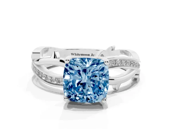 Fancy Blue Cushion Cut Solitaire Twist Band with Pavé Accents and Four-Prong Setting Platinum