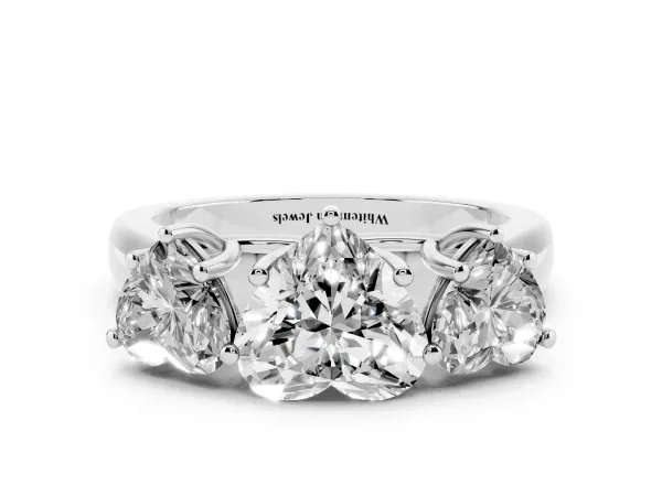 Heart Cut Three-Stone Diamond Ring with Prong Setting on a Classic Band Platinum
