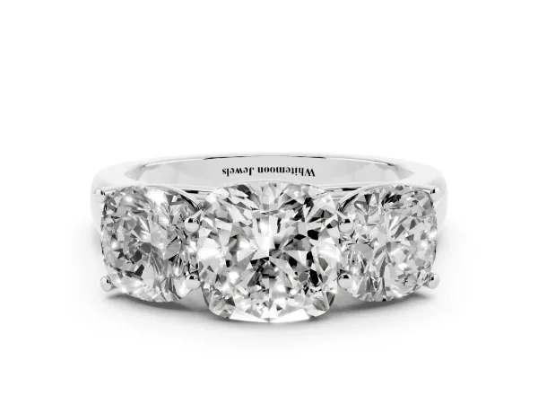 Cushion Cut Three-Stone Diamond Ring with Prong Setting on a Classic Band White gold