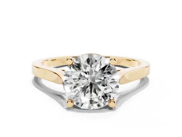 Round Cut Solitaire Diamond Ring with Four-Prong Setting and Tapered Band Yellow gold