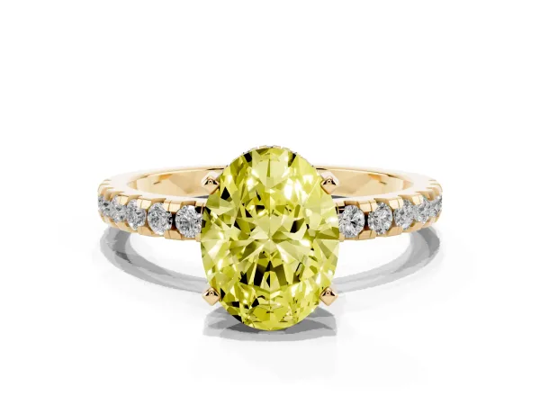Fancy Yellow Oval Cut Diamond Solitaire Ring with Round Pavé Band and Four-Prong Setting Yellow gold