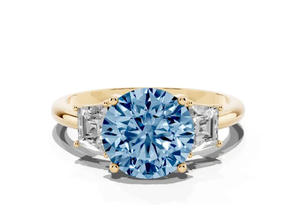 Fancy Blue Round Cut Diamond Three-Stone Ring with Trapezoid Side Stones and Prong Setting Yellow gold