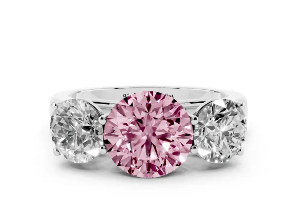 Fancy Pink Round Cut Three-Stone Diamond Ring with Prong Setting on a Classic Band Platinum