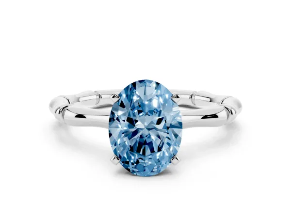 Fancy Blue Oval Cut Solitaire Diamond Ring with Bamboo Band and Four-Prong Setting Platinum