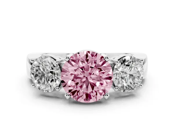 Fancy Pink Three-Stone Round Cut Diamond Ring with Round Side Stones, Classic Band, and Four-Prong Setting Platinum