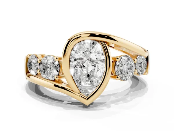 Bezel Set Pear Cut Diamond Bypass Ring with Round Accents Yellow gold