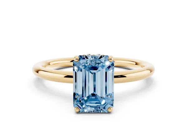 Fancy Blue Emerald Cut Solitaire Diamond Ring with a Classic Band and Four-Prong Setting Yellow gold