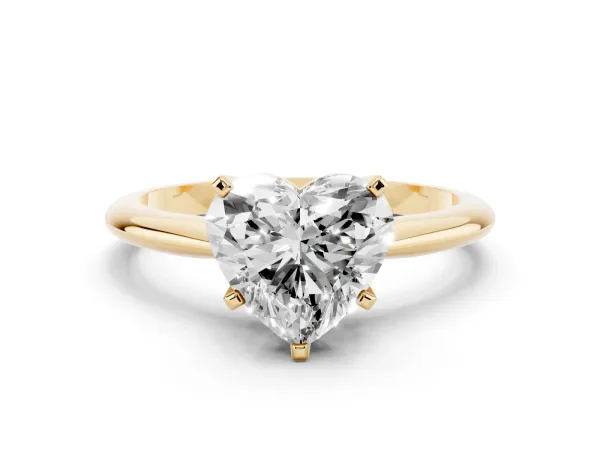 Heart Cut Cut Solitaire Ring with Four-Prong Setting on a Classic Band Yellow gold