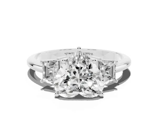 Heart Cut Diamond Three-Stone Ring with Trapezoid Side Stones and Prong Setting White gold