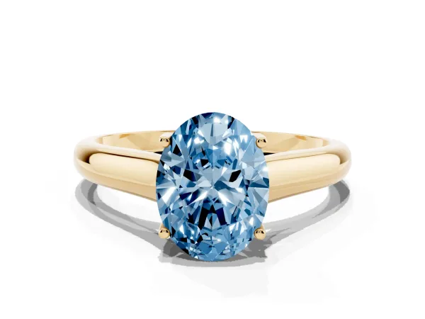 Fancy Blue Oval Cut Solitaire Engagement Ring with Tapered Band and Four-Prong Setting Yellow gold