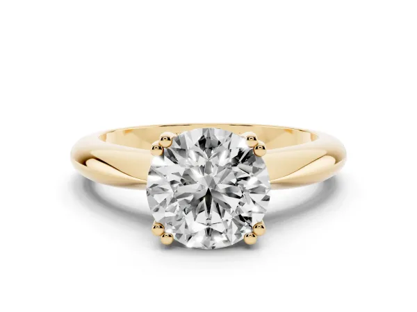 Round Cut Cut Solitaire Engagement Ring with Tapered Band and Four-Prong Setting Yellow gold