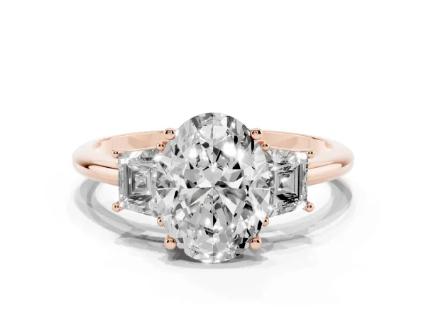 Oval Cut Diamond Three-Stone Ring with Trapezoid Side Stones and Prong Setting Rose gold