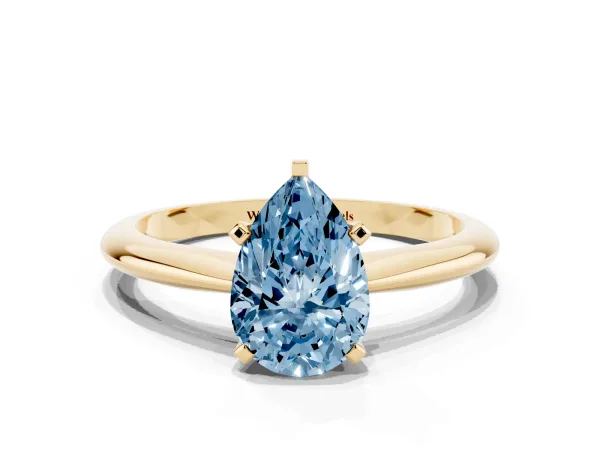 Fancy Blue Pear Cut Cut Solitaire Ring with Four-Prong Setting on a Classic Band Yellow gold