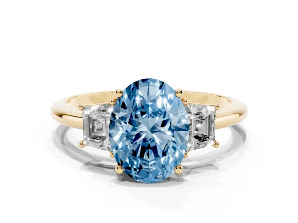 Fancy Blue Oval Cut Diamond Three-Stone Ring with Trapezoid Side Stones and Prong Setting Yellow gold