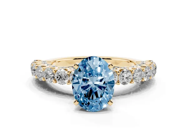 Fancy Blue Oval Cut Diamond Solitaire Ring with Shared Prong Pavé Band and Four-Prong Setting Yellow gold