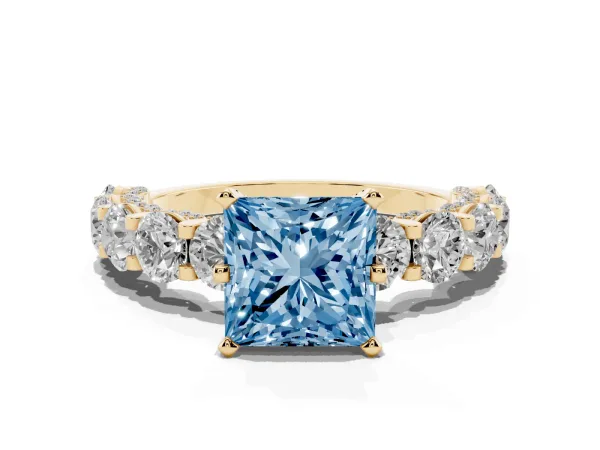 Fancy Blue Princess Cut Diamond Side Stone Engagement Ring with Four-Prong Setting Yellow gold