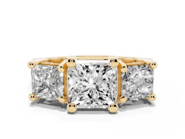 Princess Cut Diamond Three-Stone Ring with Channel Set Band and Four-Prong Setting Yellow gold