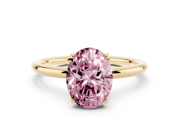 Fancy Pink Oval Cut Solitaire Diamond Ring with a Classic Band and Four-Prong Setting Yellow gold