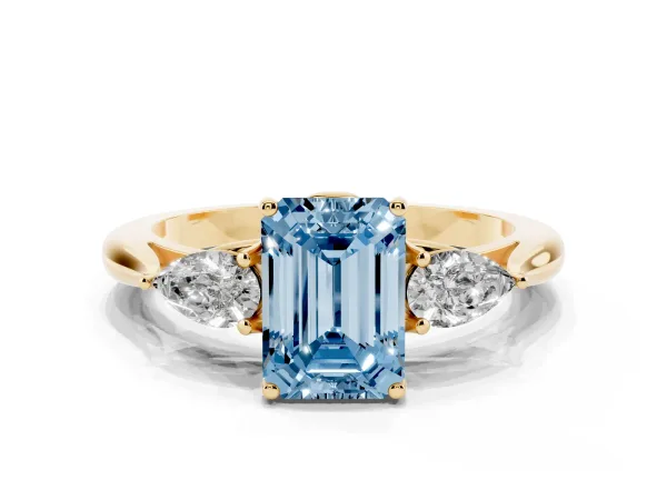 Fancy Blue Emerald Cut Diamond Three-Stone Ring with Pear Side Stones and Prong Setting Yellow gold