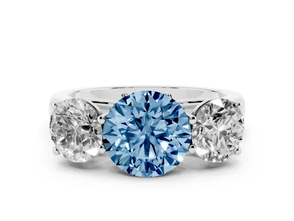 Fancy Blue Round Cut Three-Stone Diamond Ring with Prong Setting on a Classic Band Platinum