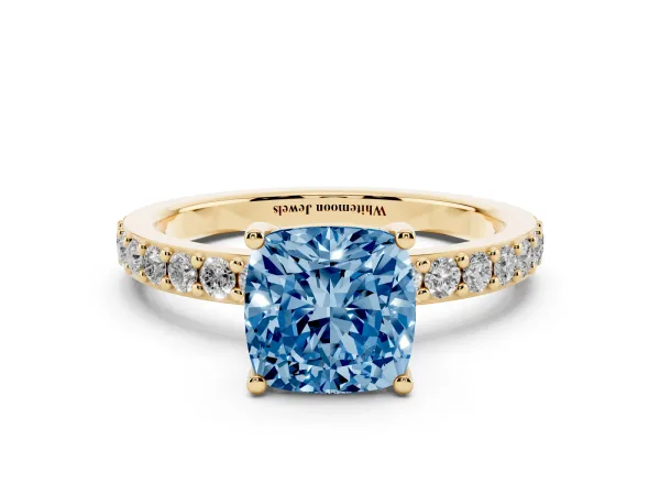 Fancy Blue Cushion Cut Cut Diamond Solitaire with Pave Band and Four-Prong Setting Yellow gold