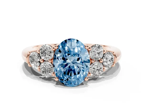 Fancy Blue Oval Cut Cut Diamond Cluster Ring with Round Accent Stones and Prong Setting on a Classic Band Rose gold