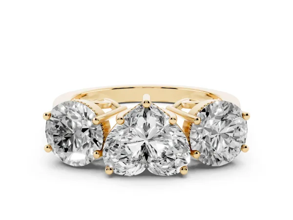 Three-Stone Heart Cut Diamond Engagement Ring with Prong Setting on a Classic Band Yellow gold